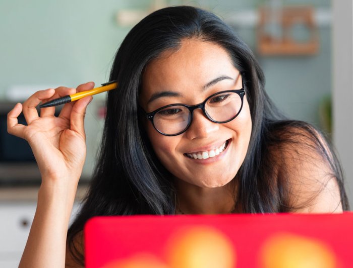 woman at laptop smiling