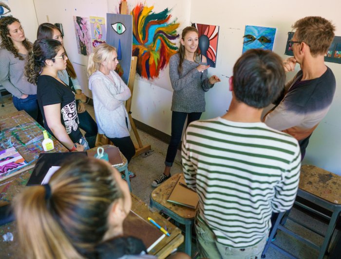 People gathering in an art exhibit