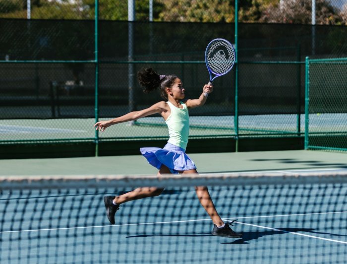 A girl playing tennis