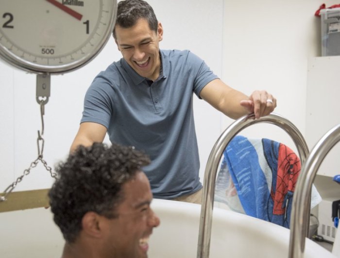 measuring human in tub