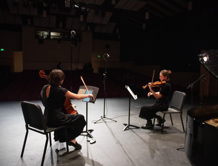 Two musicians performing on the stage at LeFevre theatre
