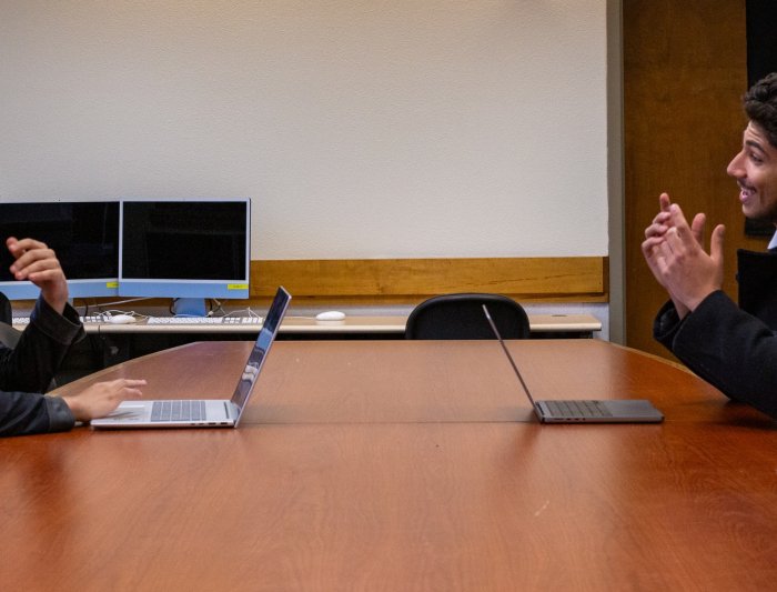 Jasper Pacheco and Luis Mora prepping in a classroom