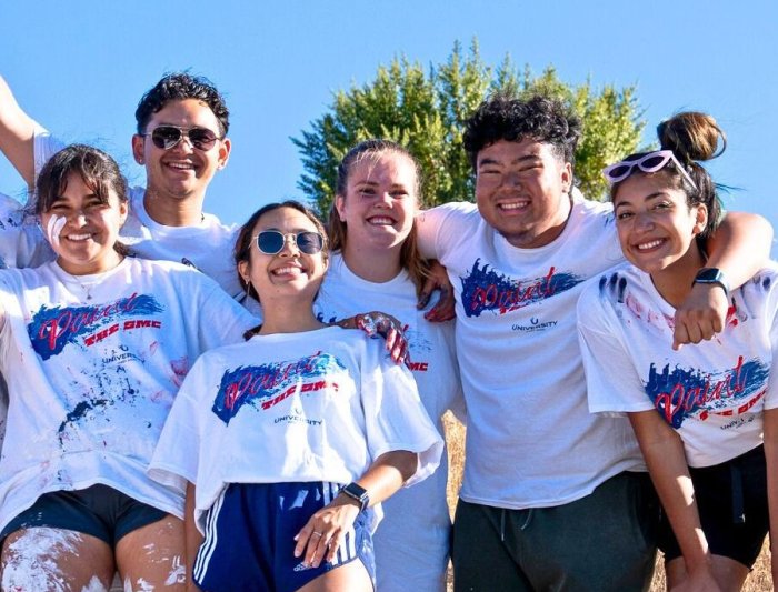 Saint Mary's Accounting Students Painting the SMC Sign