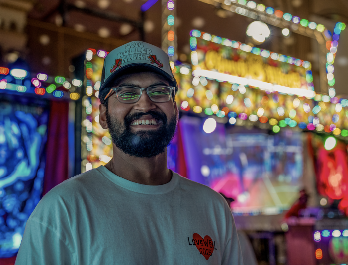 Bright Smile: Advait Powdwal ‘25 smiles for the camera during the SMC Roller Night event co-sponsored by BSU on Friday, Feb 21, 2025. / Photo By Francis Tatem.