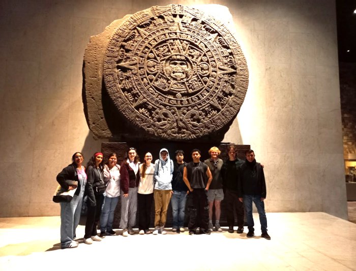 Students in front of Mayan calendar