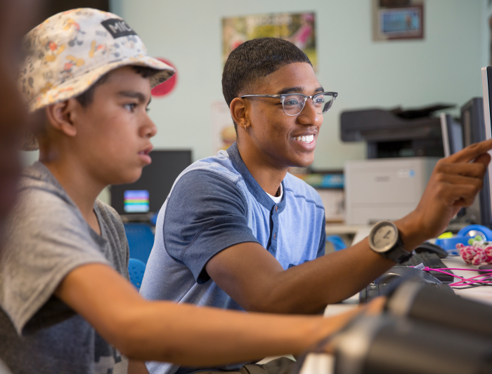 Student helping a child