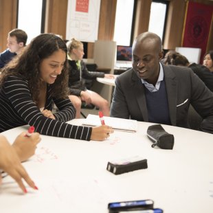 Ameer Thompson tutoring students in the STEM Center