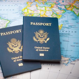 Two passports on a world map
