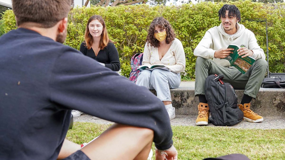 Students listen during outdoor class