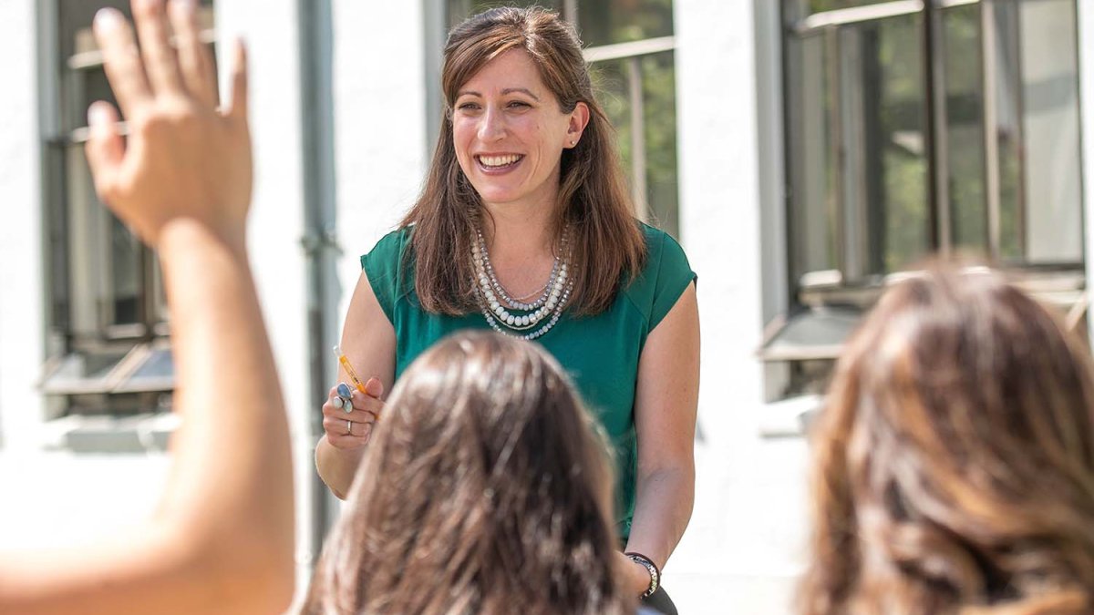 teacher laughs during outdoor class