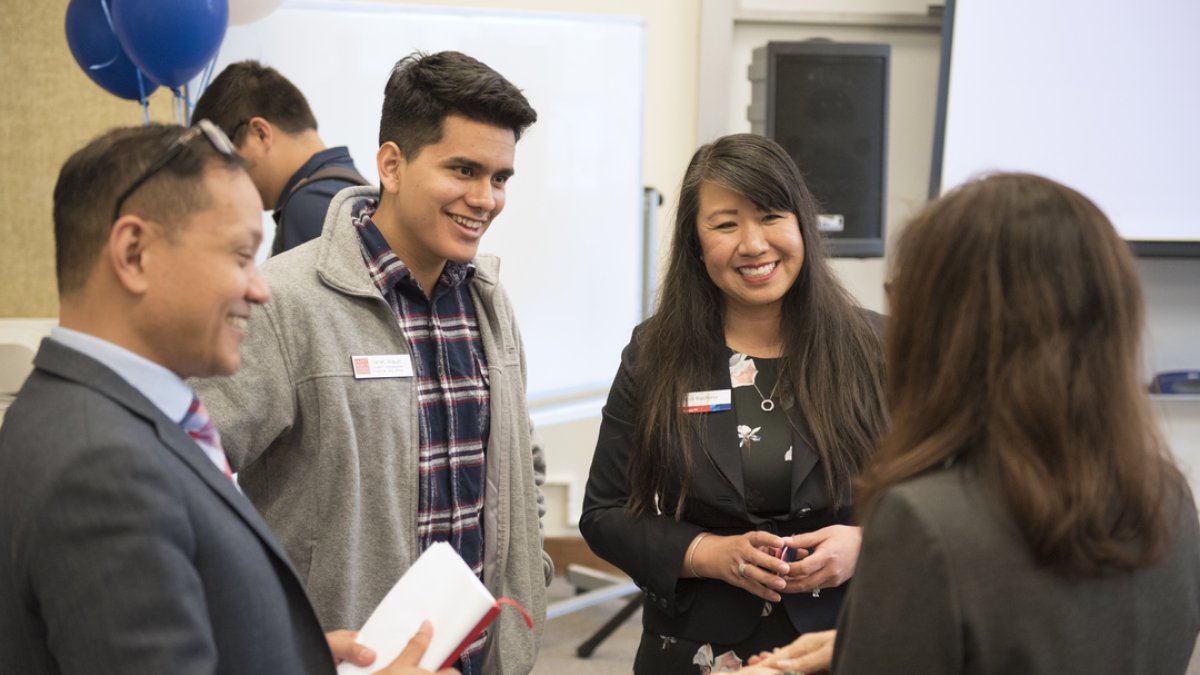 A student discusses finances with Saint Mary's employees.