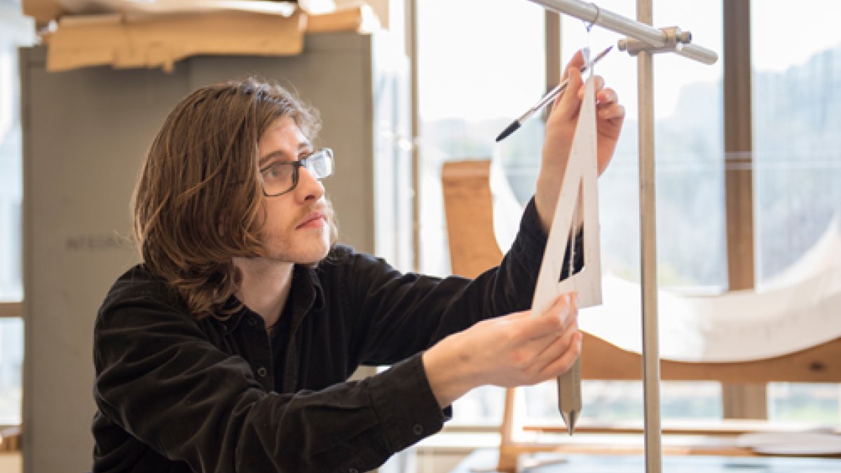 A student measuring an angle in class