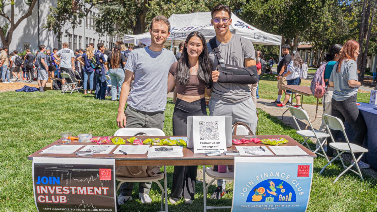 Students from the investment club and finance club standing together