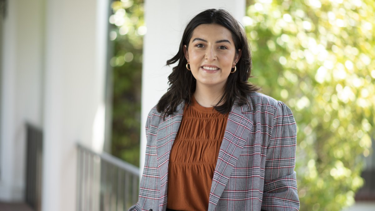 Annaliese standing in a walkway on the SMC campus. 