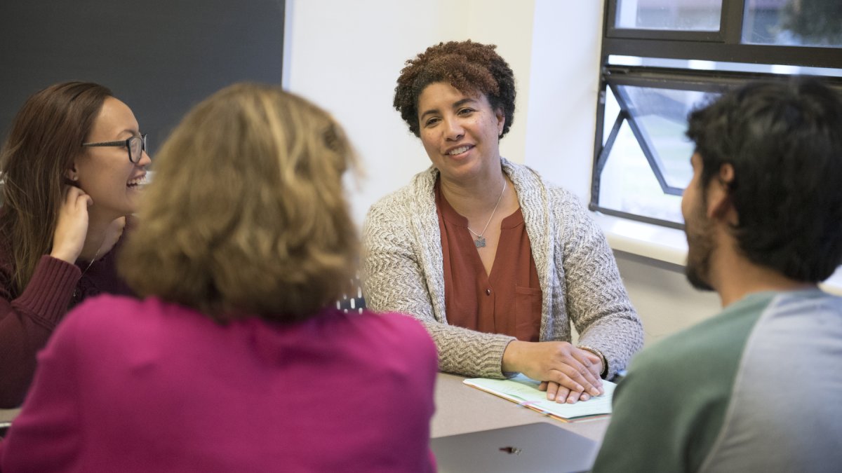 A professor is talking to students