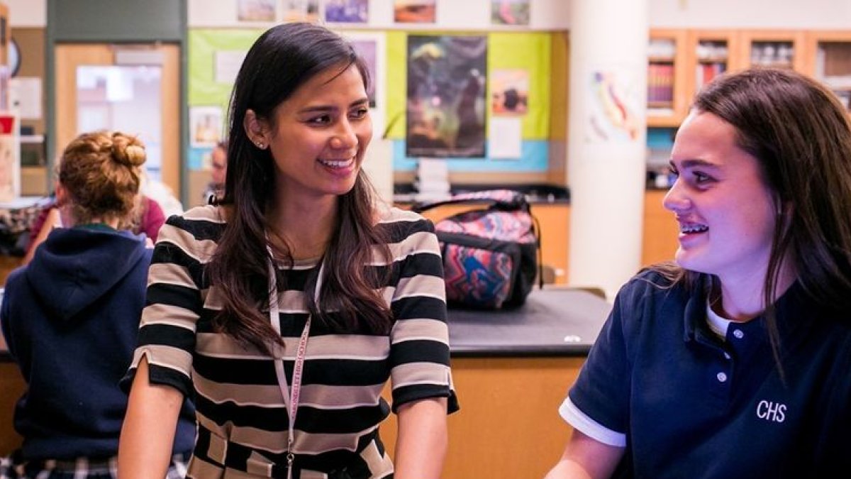 A teacher with students in a classroom