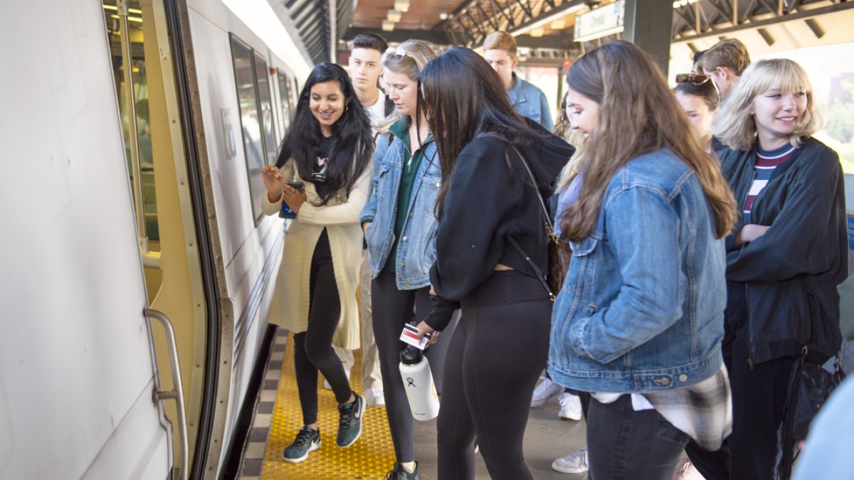 People boarding a train