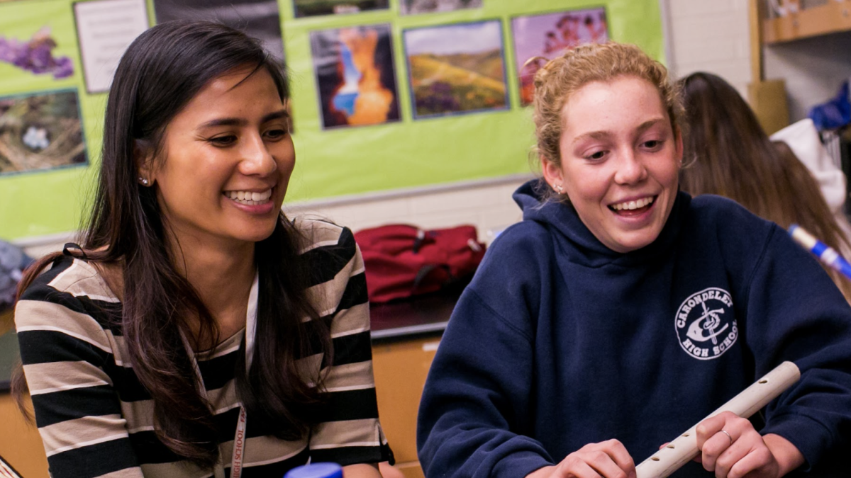 A teacher and student working together