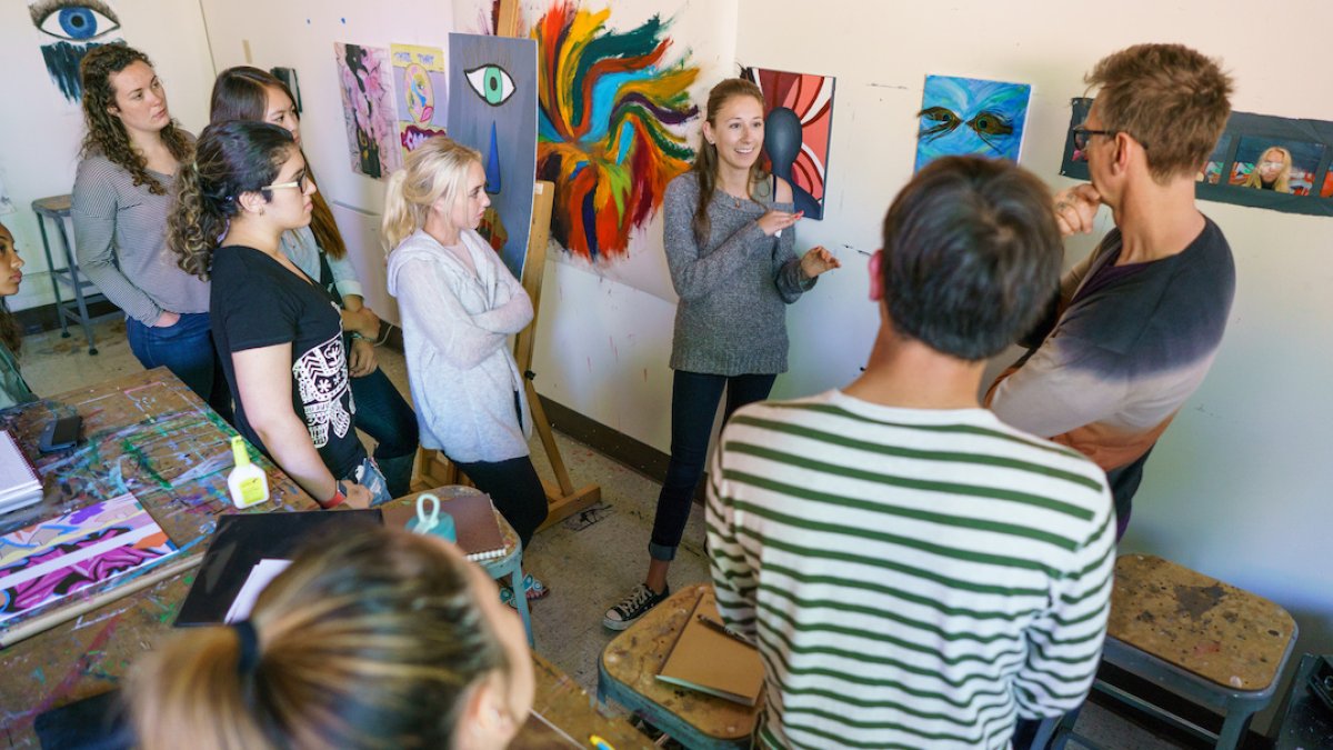 People gathering in an art exhibit