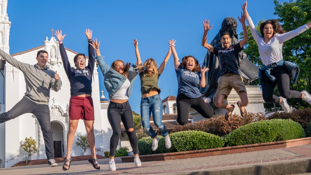 Saint Mary's Students Jumping in front of Chapel