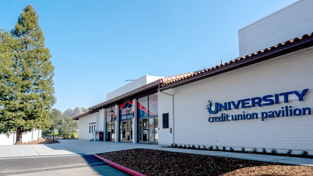 outside the UCU Pavilion with sky and tree