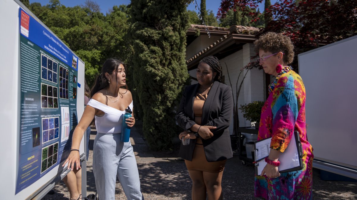 Student presenting research at a conference outside