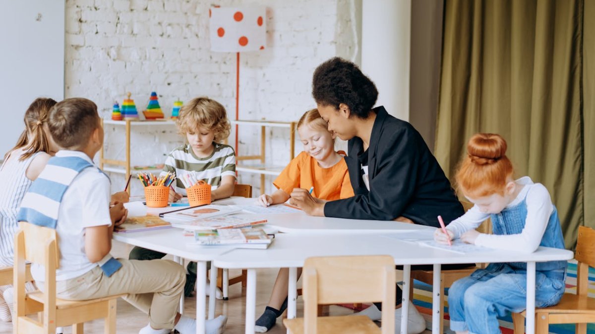  teacher in a classroom with children