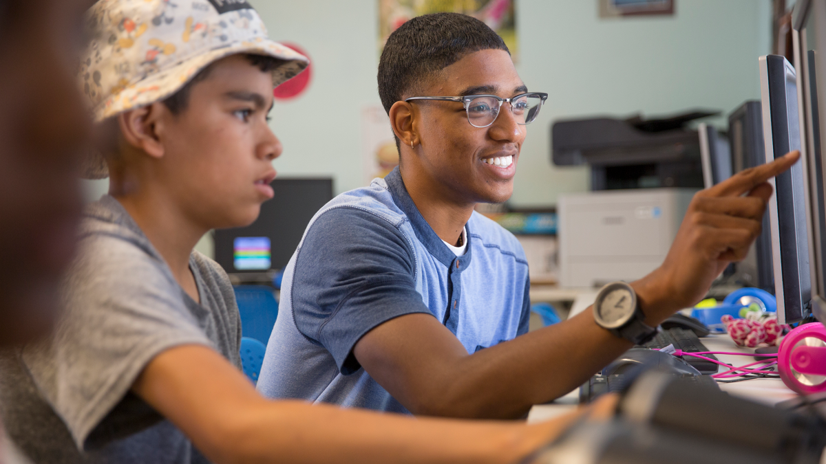 Student helping a child