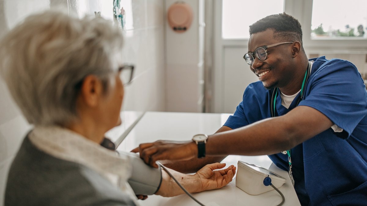 A nurse taking a patient's blood pressure