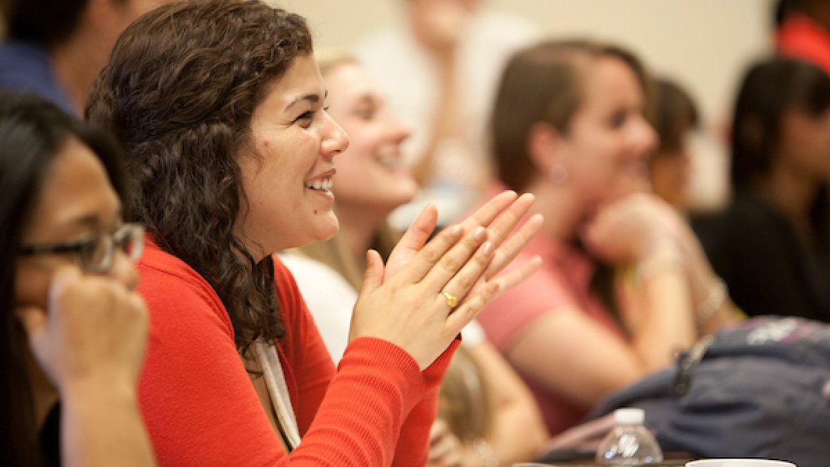 Students in class smiling