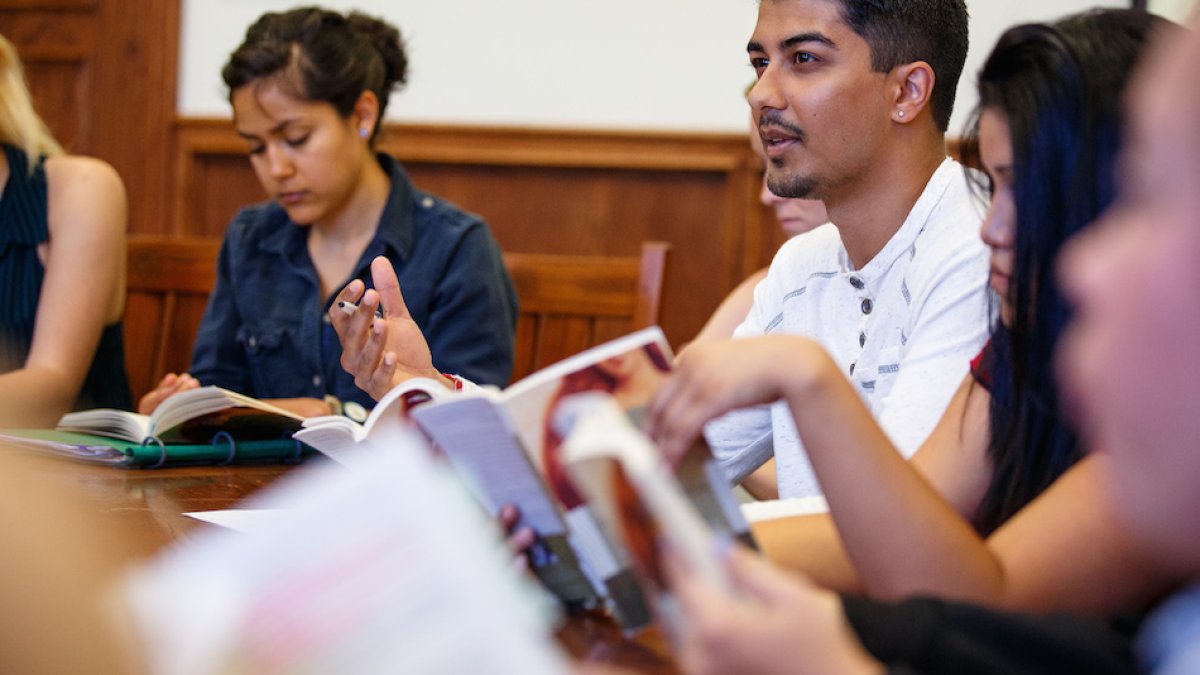 Students in Seminar class discussing a book